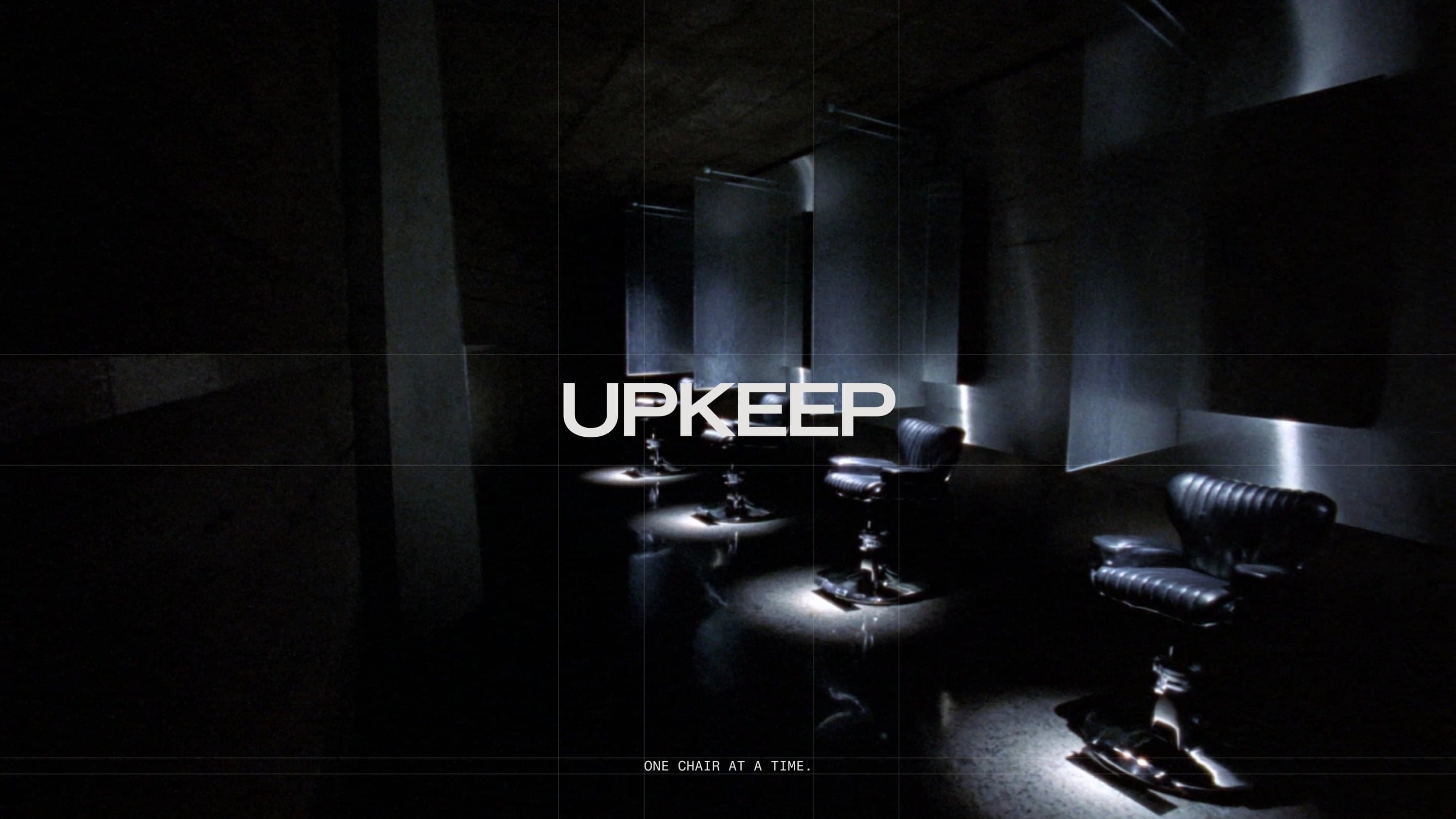 Web banner: the row of spotlit chairs with the UPKEEP wordmark across the middle and ONE CHAIR AT A TIME beneath it.